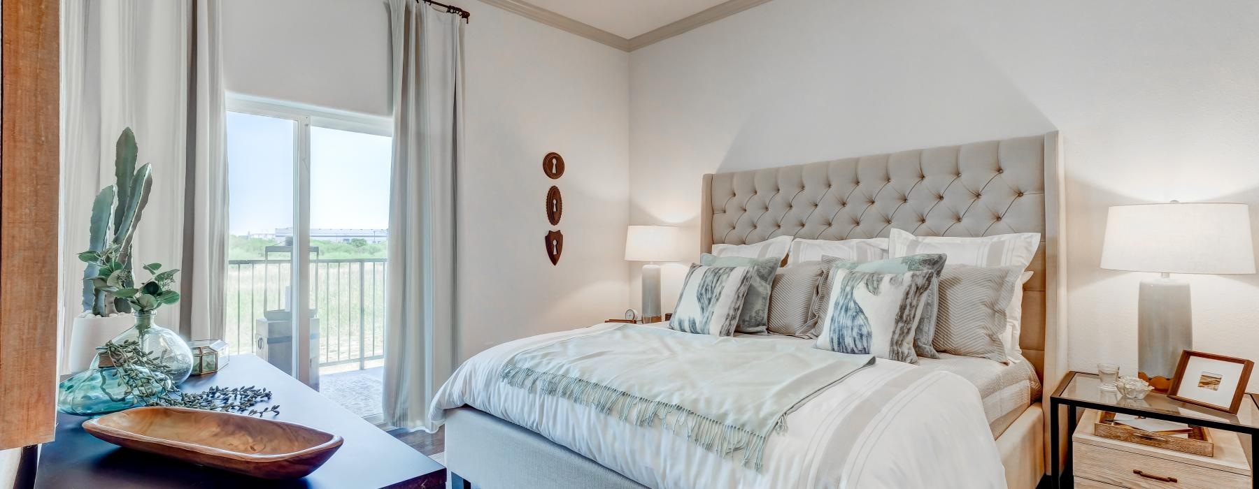 a bedroom with a large window