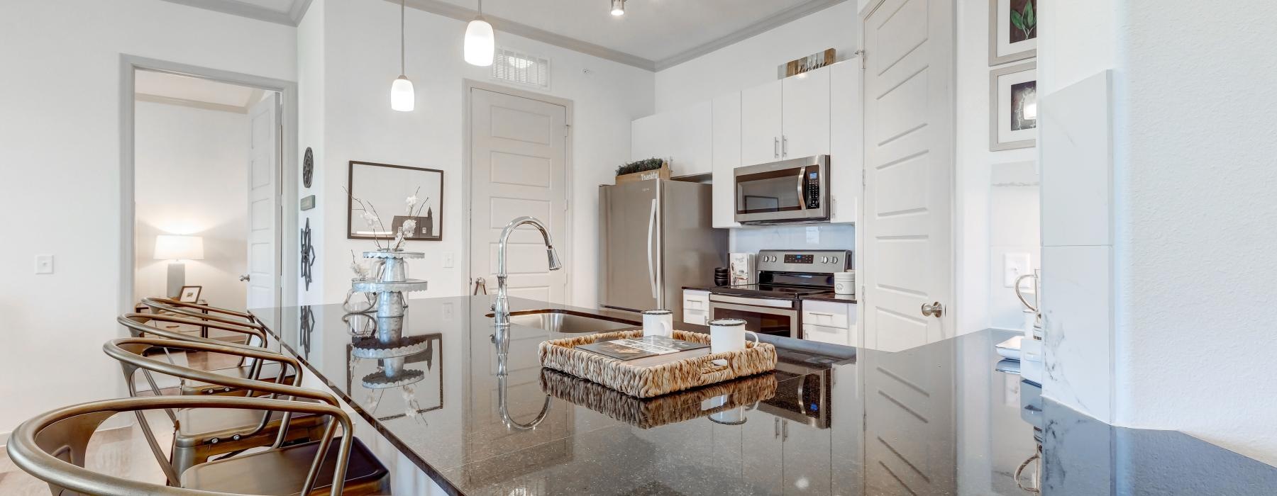a modern looking kitchen with a large glass counter