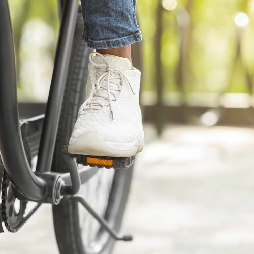 Close to the center of everything close up of someone riding a bicycle