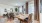 a dining room with a table and chairs